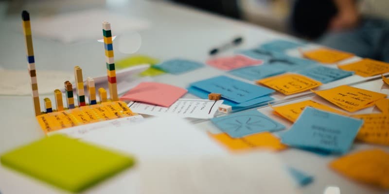 An assortment of post-it notes on a table at a CauseLabs strategy workshop