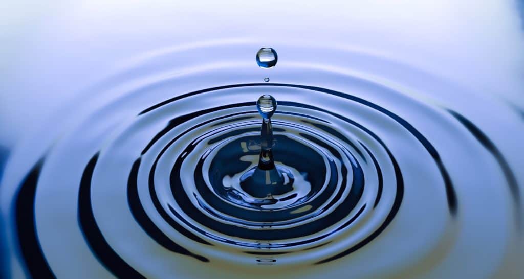 A water droplet causing ripples