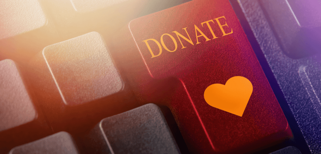 Red donation button with a heart