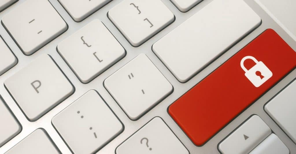 CauseLabs photo of a keyboard where there is a red security lock key Close-up of a white computer keyboard with a red key featuring a white padlock icon, symbolizing protecting your nonprofit website and ensuring data security.