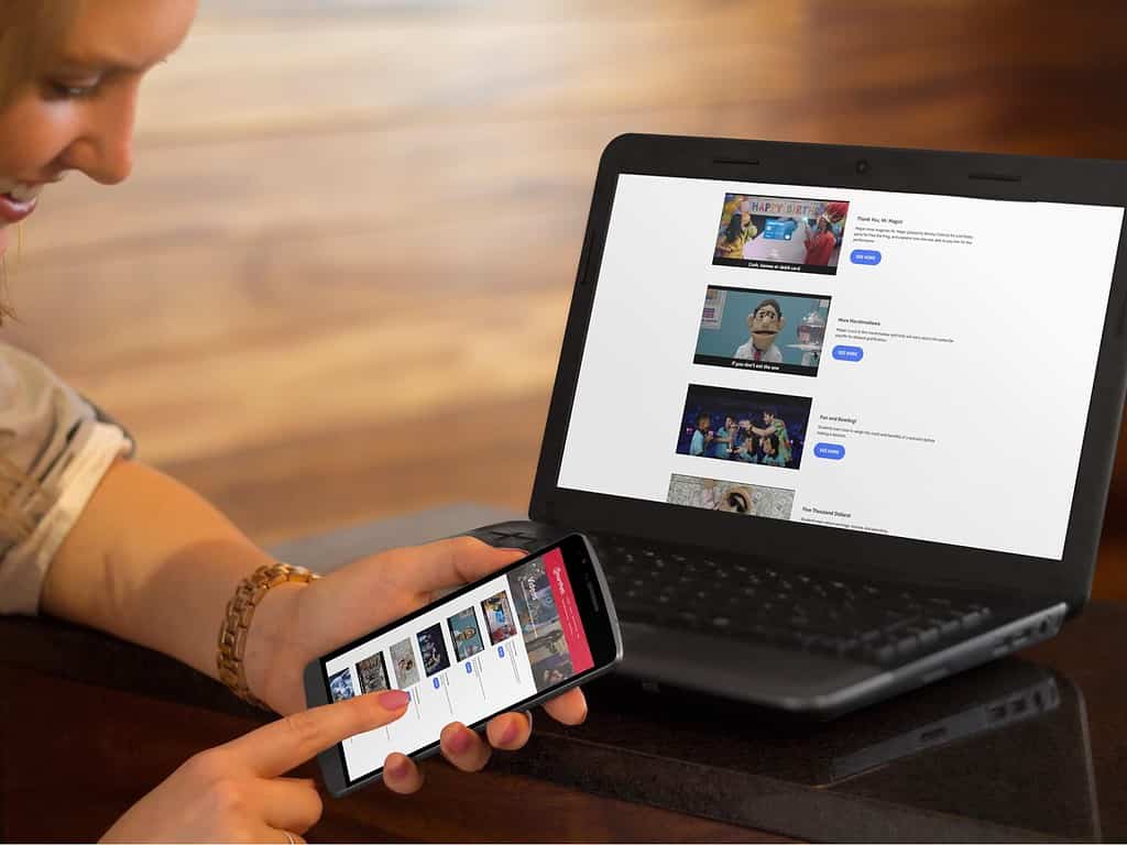 A woman viewing the $martpath website videos on her smartphone, showcasing video hosting solutions for a nonprofit website.