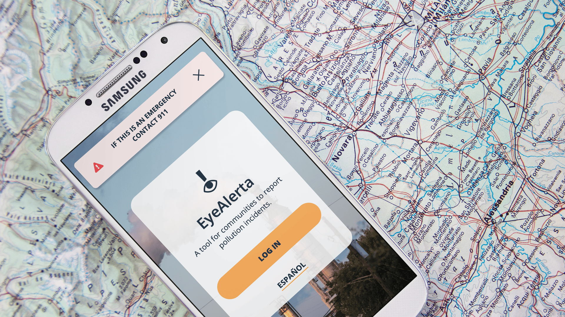 Mobile device on top of a map displaying the EyeAlerta login page.
