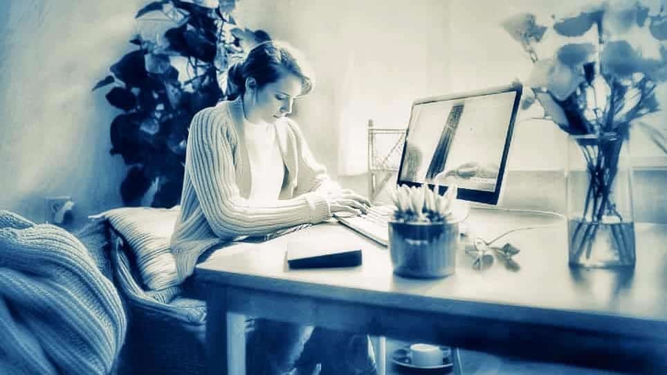 Illustration of a woman in a comfortable home looking at a website on her laptop.