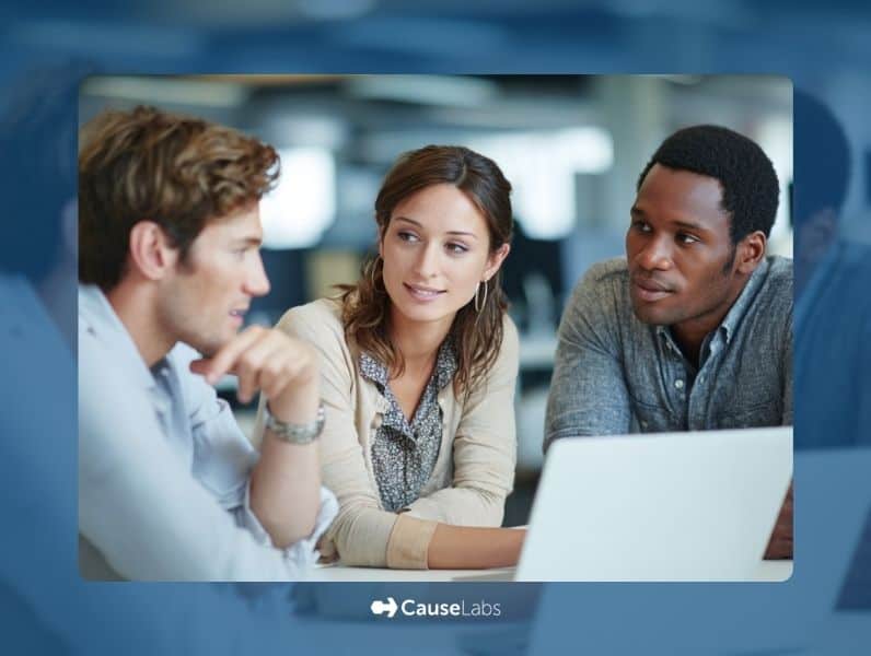 Three people sit at a table in an office, engaged in conversation, with a laptop open in front of them. The CauseLabs logo appears at the bottom of the image.