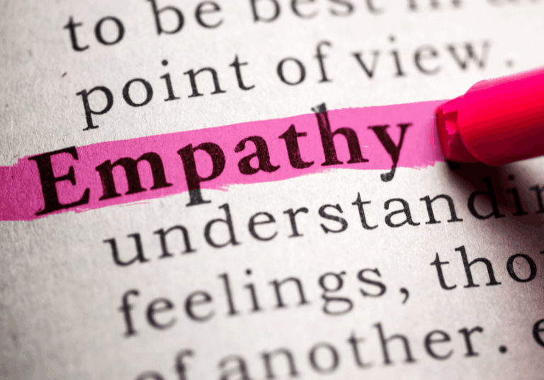 The word Empathy being highlighted in a book.