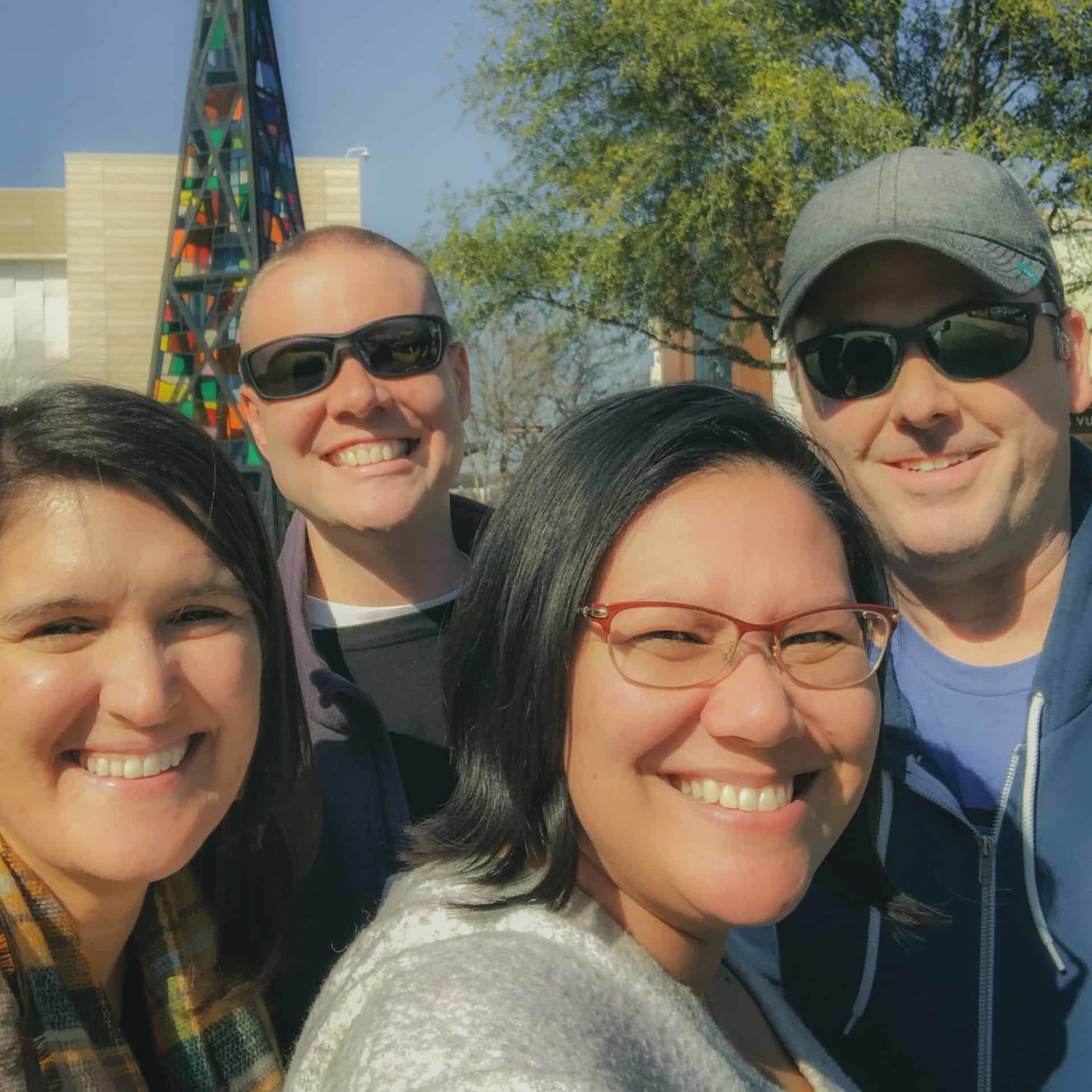 The CauseLabs leadership team poses for a selfie, outdoors.