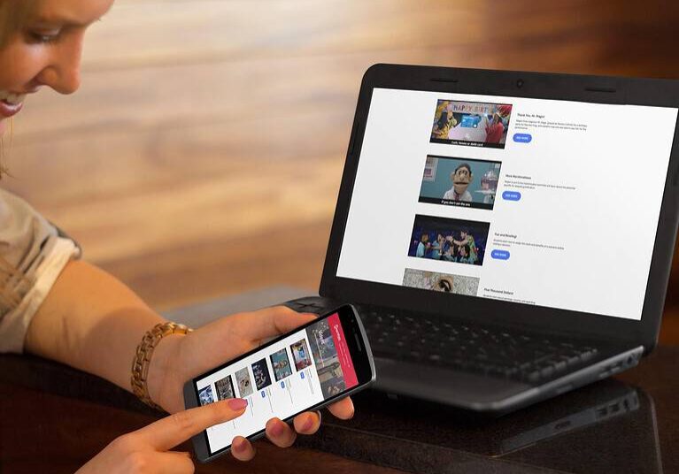 A woman viewing the $martpath website videos on her smartphone, showcasing video hosting solutions for nonprofits and responsive web design on supported browsers.