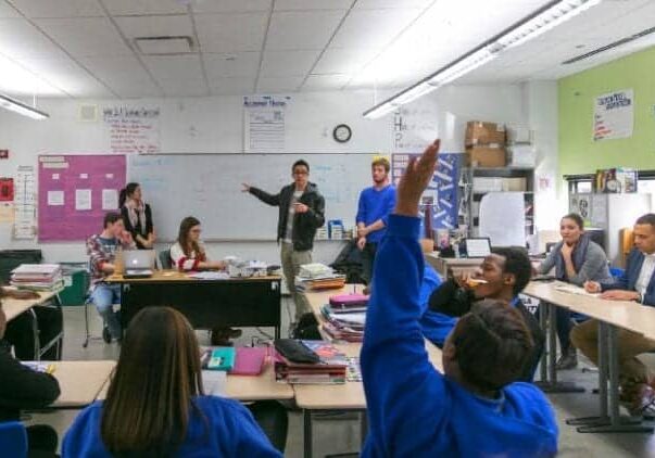 A classroom with students and teacher engaged in learning.
