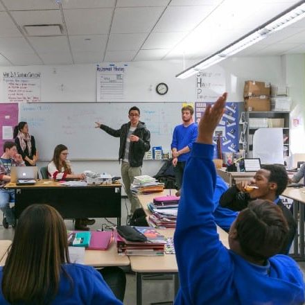 A classroom with students and teacher engaged in learning.