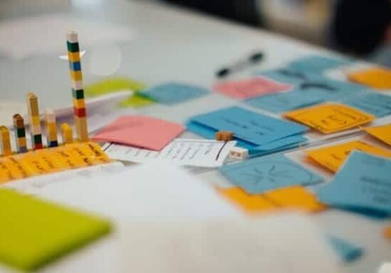 An assortment of post-it notes on a table at a CauseLabs strategy workshop