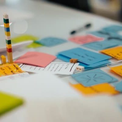 An assortment of post-it notes on a table at a CauseLabs strategy workshop